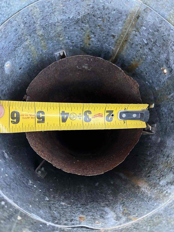 Responded to no heat complaint for 2019 furnace installation. Diagnosed issue as furnace shutting down after 30 seconds with weak flame code. Inspection revealed severely rusted roof jack causing exhaust fumes to recirculate into intake, suffocating flames. Replaced roof jack to restore proper ventilation and combustion, resolving the heating issue.