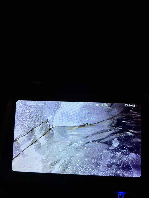 Diagnosed 25-year-old Trane gas furnace with no heat and burning odor. Found seized blower motor and identified multiple cracks in the heat exchanger via inspection camera. Although cracks were not severe enough to require immediate system shutdown, advised customer of potential carbon monoxide hazard and scheduled follow-up consultation to discuss replacement options.