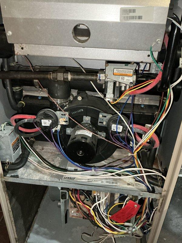 Performed comprehensive inspection on 20+ year old natural gas furnace. Diagnosed multiple critical issues including failing ignition system, heavily contaminated blower wheel, deteriorating inducer motor, and heat exchanger with borderline cracking. Based on age of equipment and extent of deficiencies, recommended complete furnace replacement as most appropriate resolution.