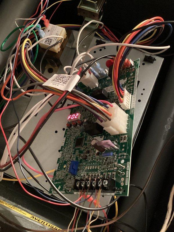Responded to callback for furnace shutting off shortly after previous service. Diagnosed recurring pressure switch fault code (F02). Visual inspection revealed faulty solder joints on control board where pressure switch wiring connects, creating intermittent connection failure. Replaced control board to restore proper system operation and heat.
