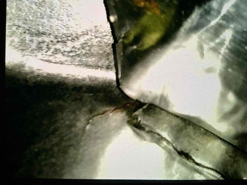 Performed tune-up inspection on 20-year-old furnace. Discovered significant deterioration including corrosion in inducer and collector box with active leakage. Visual inspection confirmed crack in heat exchanger, documented with photographic evidence. Due to critical safety concerns and extensive deterioration, recommended full furnace replacement.