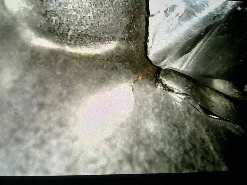 Performed tune-up inspection on 20-year-old furnace. Discovered significant deterioration including corrosion in inducer and collector box with active leakage. Visual inspection confirmed crack in heat exchanger, documented with photographic evidence. Due to critical safety concerns and extensive deterioration, recommended full furnace replacement.