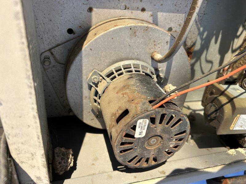 Diagnosed no-heat complaint on 20-year-old commercial rooftop furnace during -10°F conditions. Observed 3-blink error code indicating pressure switch failure and confirmed inducer motor was not operating despite 210V power supply. Inspection revealed aging inducer assembly with significant dust accumulation and corrosion. Recommended inducer motor replacement; estimate provided through parts department.