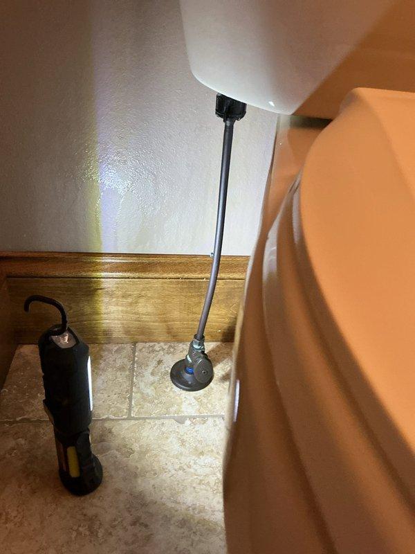 Responded to basement toilet leak caused by faulty fill valve gasket. Replaced fill valve assembly and tightened bathroom lavatory handle to resolve issues. Visual inspection confirmed proper operation of new components with no further leakage observed.