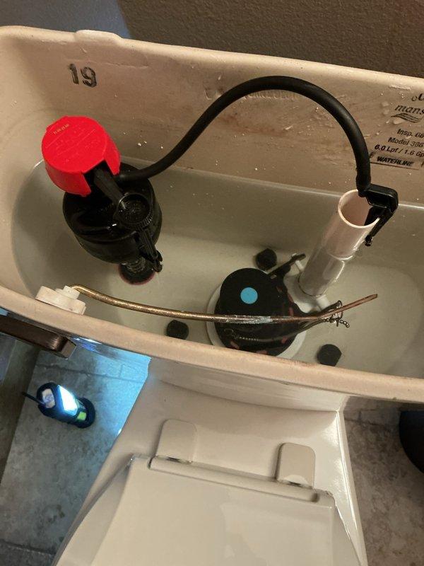 Responded to basement toilet leak caused by faulty fill valve gasket. Replaced fill valve assembly and tightened bathroom lavatory handle to resolve issues. Visual inspection confirmed proper operation of new components with no further leakage observed.