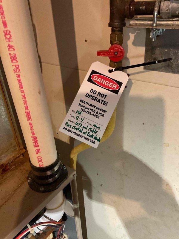 Found 27-year-old furnace with no heat due to cracked heat exchanger. Flame rollout safety switch was tripped. System was tagged out as unsafe to operate and red-tagged the gas valve with proper warning documentation. Customer informed that replacement is necessary as the current unit poses a carbon monoxide hazard.