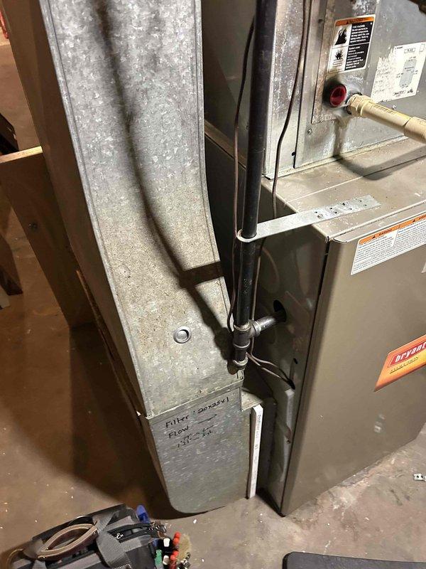 Performed furnace tune-up on 20-year-old FRP unit. Cleared condensate drain line and trap of accumulated spiderwebbing and debris. Verified normal operation of all key components (inducer motor, capacitor, pressure switch, control board connections, thermostat) with combustion CO at 9 ppm. Return air filter in moderate condition. System operating within normal parameters with no immediate concerns identified.