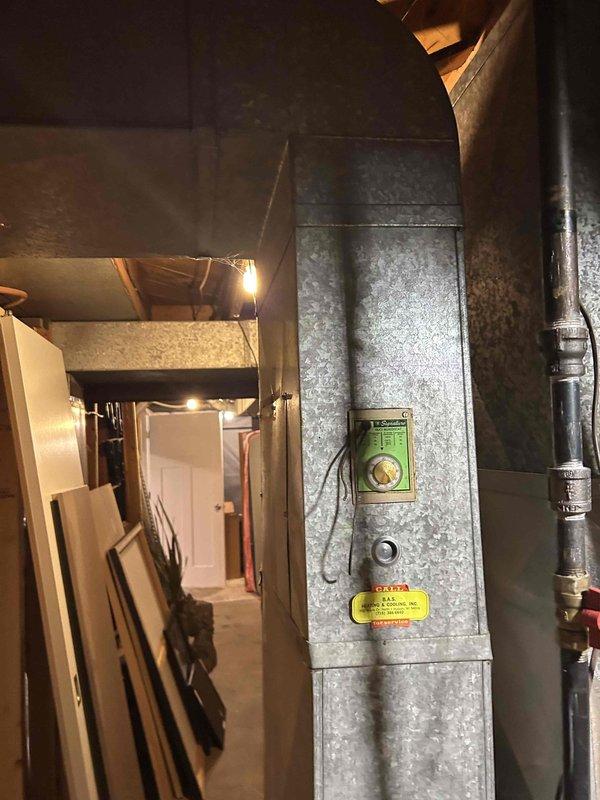 Performed furnace tune-up on 20-year-old FRP unit. Cleared condensate drain line and trap of accumulated spiderwebbing and debris. Verified normal operation of all key components (inducer motor, capacitor, pressure switch, control board connections, thermostat) with combustion CO at 9 ppm. Return air filter in moderate condition. System operating within normal parameters with no immediate concerns identified.