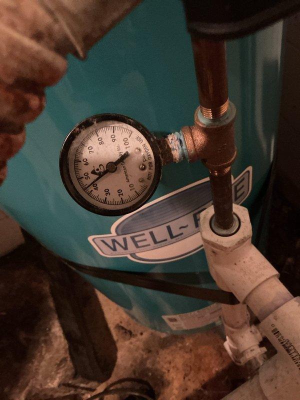 Responded to customer-reported water leak following recent HVAC installation. Conducted comprehensive inspection of basement mechanical room, focusing on water pressure system. Identified minor corrosion at copper fitting connection to pressure gauge showing 30-40 PSI reading on well water pressure tank. Repaired connection point to resolve leak, ensuring proper system pressure and function.