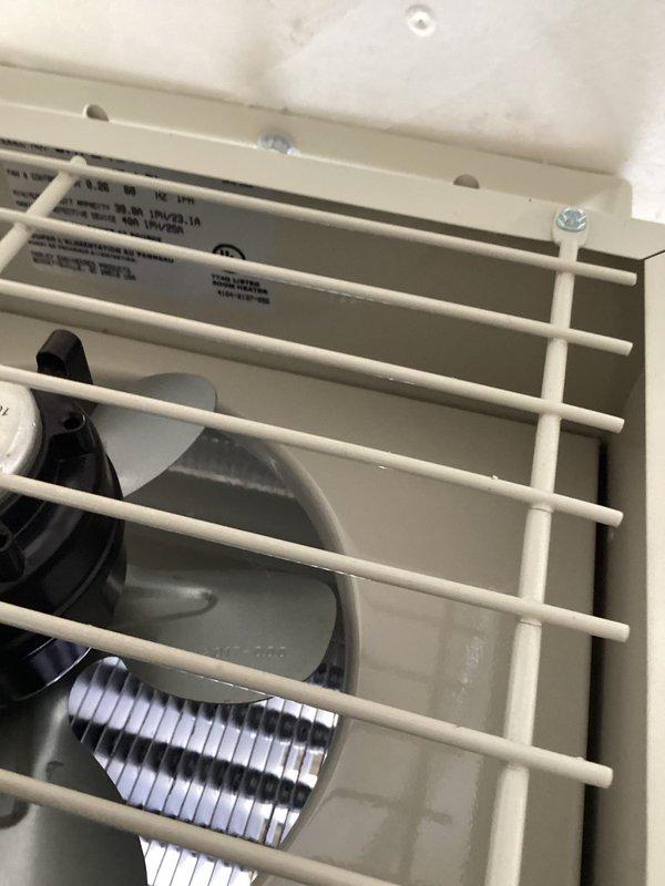 Diagnosed garage heater failure caused by faulty contactor preventing system startup. Inspected fan assembly and housing, noting heavy wear consistent with unit's age (10+ years). Customer was not on premises during service; accessed garage via provided code and documented findings with photos, but no repair was authorized.