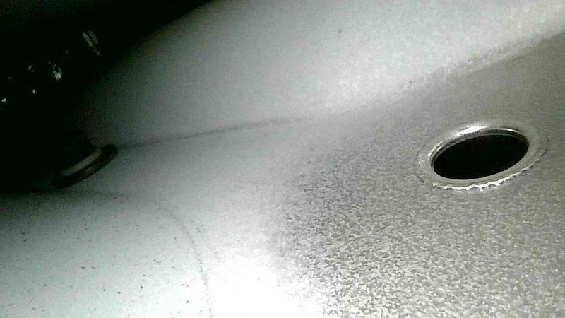 Conducted non-member tune-up service on a relatively new heat pump system with older backup gas heating. Replaced dirty air filter and performed standard preventive maintenance procedures. Observed and photographed system components including drainage port and ceiling vent for documentation purposes.