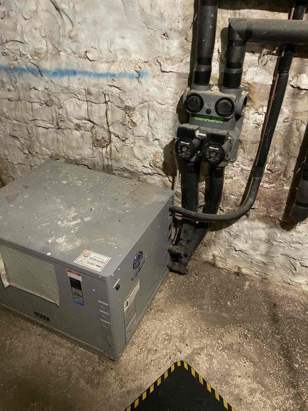 Responded to no heat complaint for 10-year-old geothermal system. Diagnostic inspection revealed frozen coaxial heat exchanger with significant loop field pump imbalance - one pump running excessively hot while the other was ice cold. System appears to be original installation. Informed occupant of findings and recommended contacting the original installer (Water Source) for specialized geothermal service as we are not currently accepting new geothermal customers.