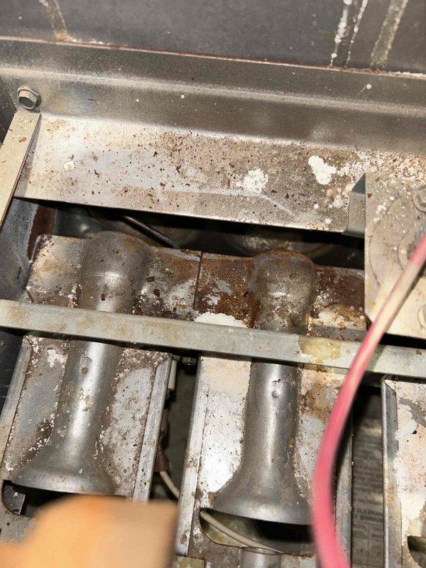 Performed furnace tune-up on 29-year-old FRP unit. Detected elevated carbon monoxide levels (25 ppm). After inspection revealed no cracks or holes in heat exchanger, cleaned flame sensor and removed debris from burners and orifice which resolved initial flame failure issue. Installed carbon monoxide/gas detectors on both floors and recommended regular filter changes every 3 months. Noted rusty burners and oily spots on blower motor for future monitoring; estimate sent for replacement parts.