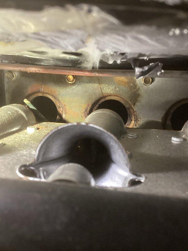 Diagnosed LP furnace failure showing pressure switch error code. Upon inspection, identified significant cracks on burner face plate and confirmed a substantial hole in the heat exchanger passageways via camera inspection. Customer declined both heat exchanger replacement and service advisor visit, indicating they would pursue furnace replacement with another provider.