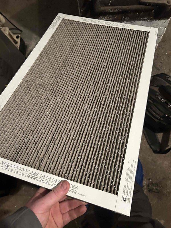 Responded to no heat complaint on 9-year-old furnace where thermostat was operational but temperature continued to drop. Diagnosed and corrected system failure due to tripped open limit switch caused by severely plugged filter. Replaced filter, verified proper operation for 15 minutes, and advised customer to replace filter every 2-3 months using maximum MERV 8 rated filters to prevent recurrence.
