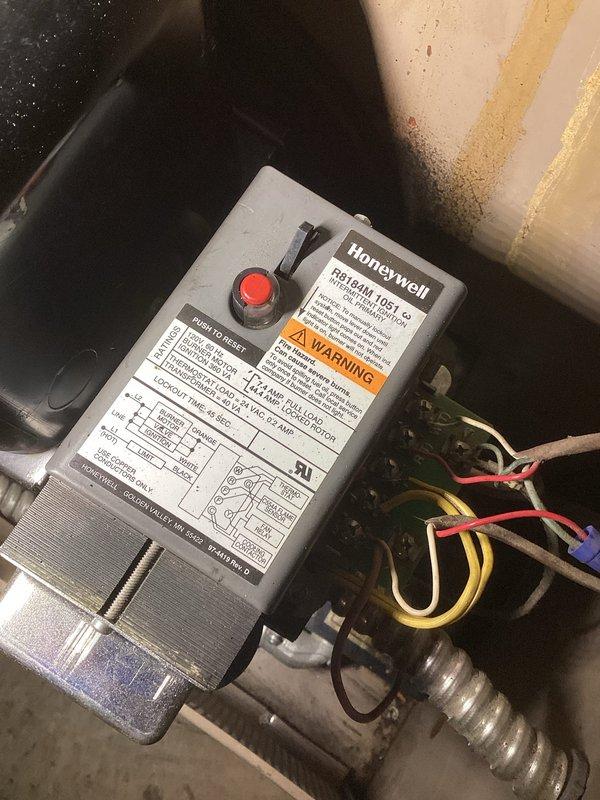 Diagnosed oil furnace failure in non-heating condition. Located Honeywell R8184M primary control module in lockout state. Reset module without success. Upon inspection of oil flow, nozzle, electrodes, and transformer, determined transformer to be malfunctioning. Placed order for replacement transformer to restore heating capability.
