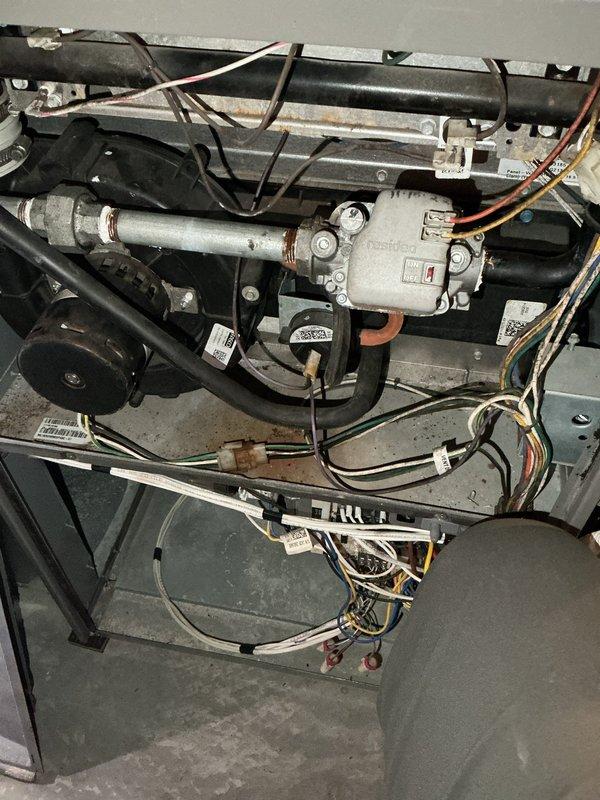 Responded to service call for 22-year-old furnace making loud noise. Diagnosed failing inducer motor and possible secondary heat exchanger leak. Replaced inducer motor to restore proper operation, though unit may require full replacement in near future due to age and potential heat exchanger issues.