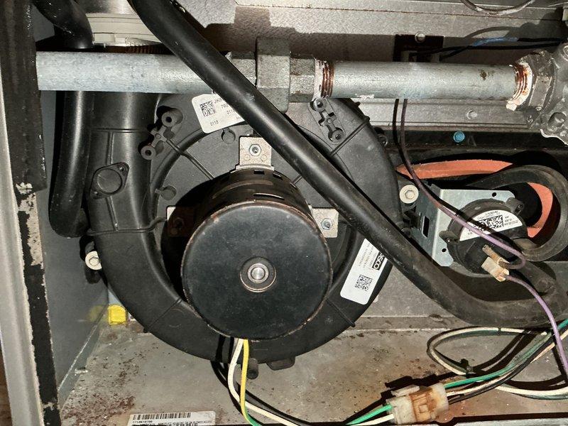Responded to service call for 22-year-old furnace making loud noise. Diagnosed failing inducer motor and possible secondary heat exchanger leak. Replaced inducer motor to restore proper operation, though unit may require full replacement in near future due to age and potential heat exchanger issues.