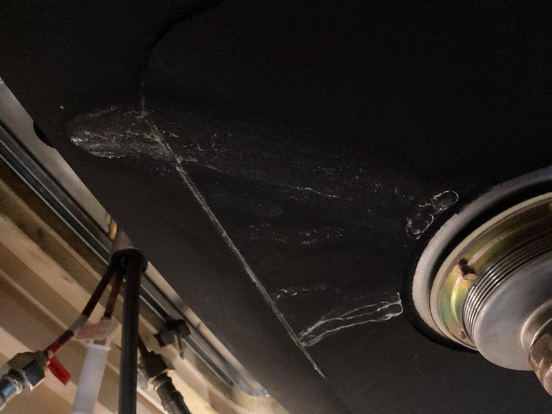 Responded to emergency service call regarding dishwasher leak affecting multiple units. Upon inspection, identified dishwasher failure causing water penetration through ceiling into apartment below. Removed damaged dishwasher to allow area to dry out and inspected under-sink plumbing connections. Also noted additional damage to kitchen sink requiring replacement. Provided estimate for new dishwasher installation and sink/faucet replacement.