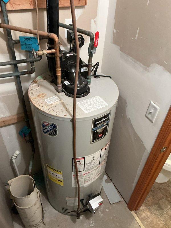 Diagnosed 7-year-old 50 gallon natural gas water heater displaying error code indicating a faulty gas valve. Replaced defective gas valve assembly along with thermal coupling and gas harness, restoring proper hot water functionality to unit.
