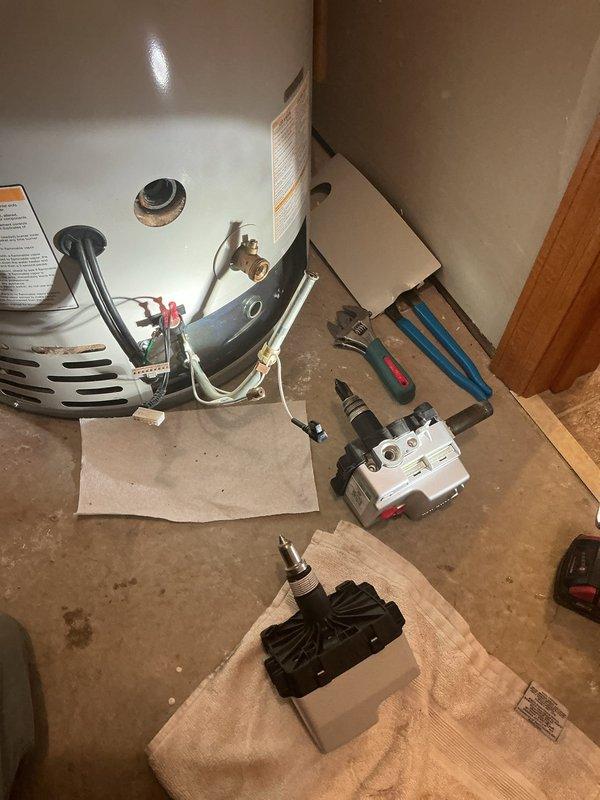 Diagnosed 7-year-old 50 gallon natural gas water heater displaying error code indicating a faulty gas valve. Replaced defective gas valve assembly along with thermal coupling and gas harness, restoring proper hot water functionality to unit.