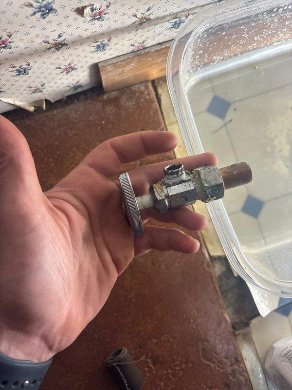 Responded to service call for kitchen sink leak. Diagnosed faulty angle stop valve for dishwasher that was not completely shutting off, causing water leakage under the sink. Isolated water supply and replaced defective angle stop valve with new unit, restoring proper functionality and eliminating leak.