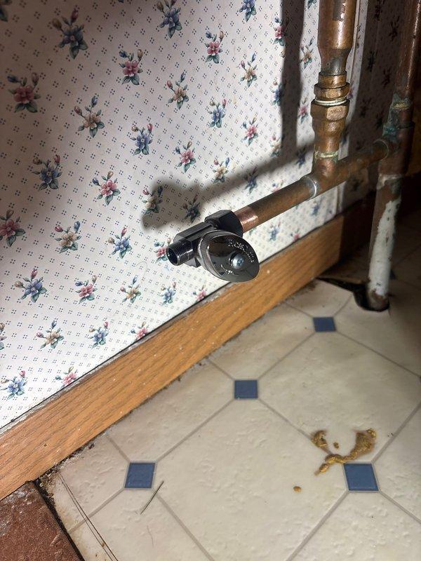 Responded to service call for kitchen sink leak. Diagnosed faulty angle stop valve for dishwasher that was not completely shutting off, causing water leakage under the sink. Isolated water supply and replaced defective angle stop valve with new unit, restoring proper functionality and eliminating leak.