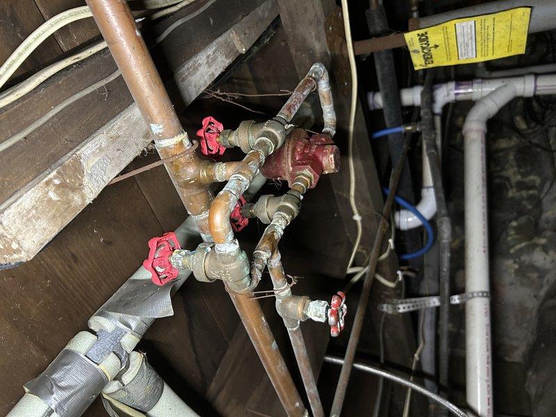 Responded to service call for a boiler with no heat in the upstairs portion of the house. Diagnosed low water level in system and air in upstairs radiators. Manually added water to the boiler using bypass since the auto-fill feature is non-functional, bled air from radiators, and restored system to proper operating temperature. All heating functions now operating correctly.