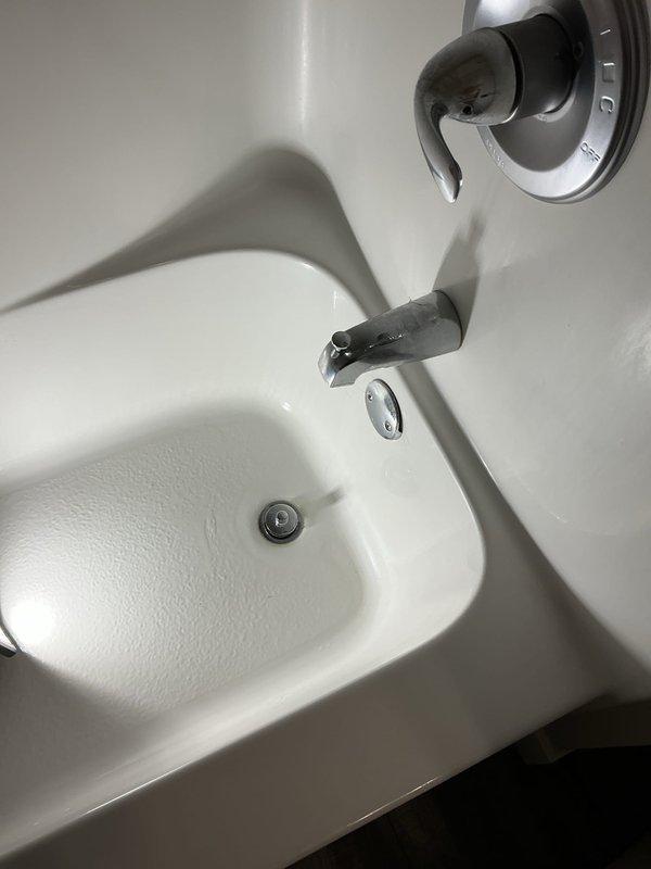 Investigated and resolved two plumbing issues: repaired a leaking bathtub drain that was causing water damage to the basement ceiling by removing the drain, cleaning it, and applying silicone sealant to replace the failed putty seal. Also addressed slow drainage in master bathroom tub by removing hair buildup from the drain line, restoring proper flow.