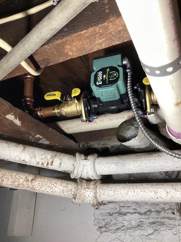 Installed circulator pump to improve flow on non-functional towel warming rack system. Bled air from lines and adjusted system pressure to 20 psi. Verified proper heating operation after modifications were complete.