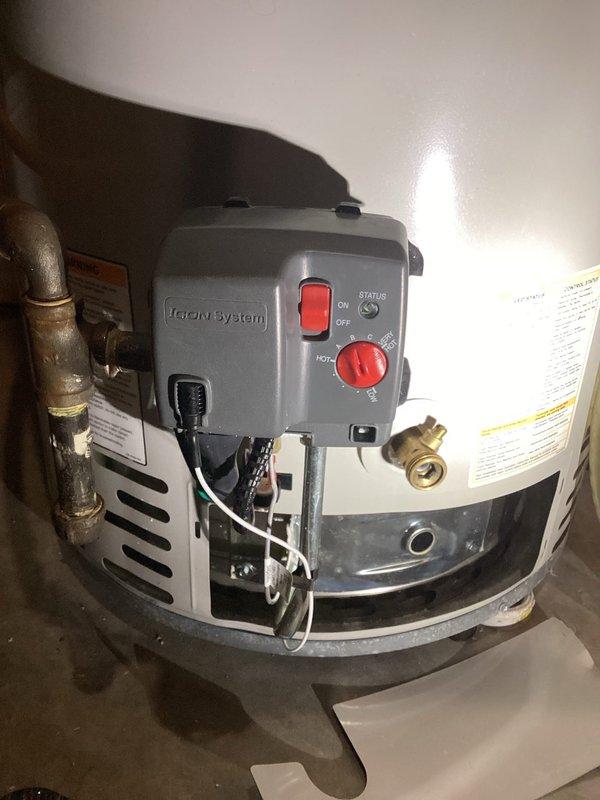 Responded to service call for Bradford White water heater exhibiting temperature regulation issues. Inspected unit and found thermal relief valve had activated twice in past month, though system was functioning normally during visit. Suspected faulty gas valve and advised customer to document error code if issue recurs for warranty replacement. Unit is approximately 2 years old with properly installed expansion tank and plumbing connections.