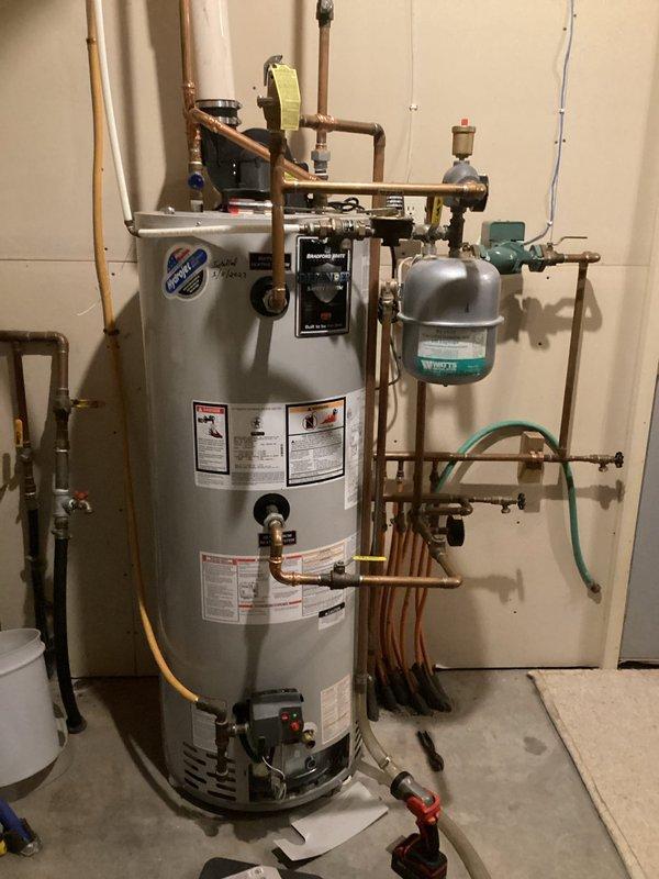 Responded to service call for Bradford White water heater exhibiting temperature regulation issues. Inspected unit and found thermal relief valve had activated twice in past month, though system was functioning normally during visit. Suspected faulty gas valve and advised customer to document error code if issue recurs for warranty replacement. Unit is approximately 2 years old with properly installed expansion tank and plumbing connections.
