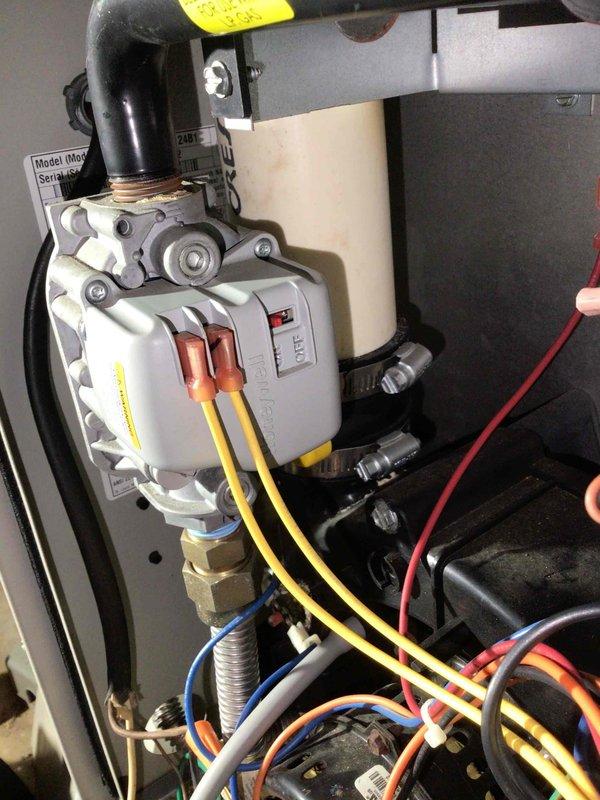 Responded to no heat call for 10-year-old system where customer reported unit would start then shut down. Upon inspection, identified gas valve showing visible smoke emission and electrical burning odor. Visual examination confirmed smoke coming from valve with no other apparent damage or over-voltage conditions. Customer was provided replacement options for the defective gas valve but declined service. Noted that system has been converted for propane use as indicated by warning label on valve assembly.