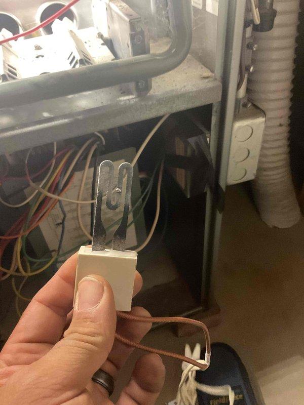 Responded to no-heat call for 28-year-old furnace that was blowing cold air and not igniting. Diagnostic testing confirmed failed hot surface igniter (HSI). Replaced defective HSI component and verified proper system operation with combustion analysis using Testo 310 analyzer.