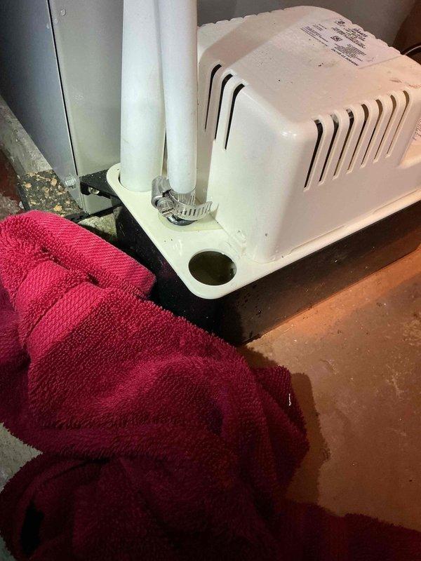 Responded to call back for heat pump installation showing condensate leak of approximately one pint daily. Identified improper use of PVC piping on condensate line instead of clear vinyl tubing as the cause of leakage. Secured connection temporarily with clamp to prevent immediate leakage; will return to replace PVC with appropriate clear vinyl tubing if issue persists.