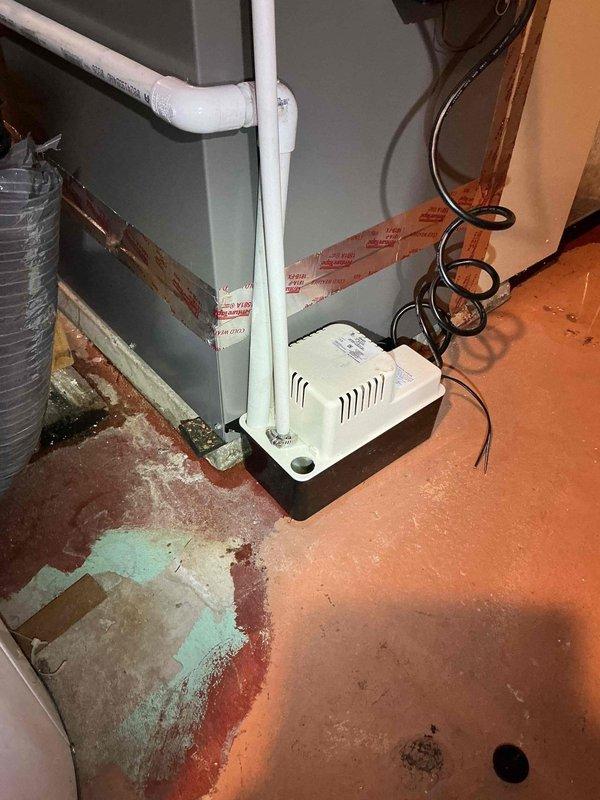 Responded to call back for heat pump installation showing condensate leak of approximately one pint daily. Identified improper use of PVC piping on condensate line instead of clear vinyl tubing as the cause of leakage. Secured connection temporarily with clamp to prevent immediate leakage; will return to replace PVC with appropriate clear vinyl tubing if issue persists.