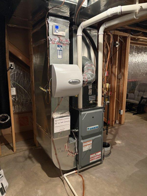 Performed scheduled tune-up on 10-year-old Daikin furnace which was operational but leaking water. Diagnosed worn inducer gasket causing the leak and applied high-temperature silicone as temporary seal until replacement gasket can be installed. Customer noted occasional hose plugging issues which was also inspected during service.