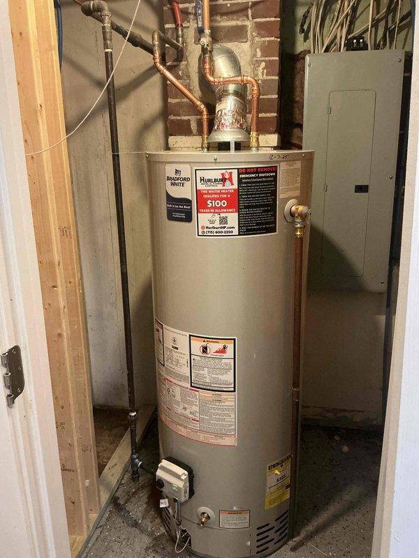 Responded to service call for inoperative water heater. Diagnosed leaking tank in existing unit. Removed failed water heater and installed new 50-gallon Bradford White natural gas standard vent water heater. Completed all necessary connections, verified proper function, and ensured installation complies with code requirements.