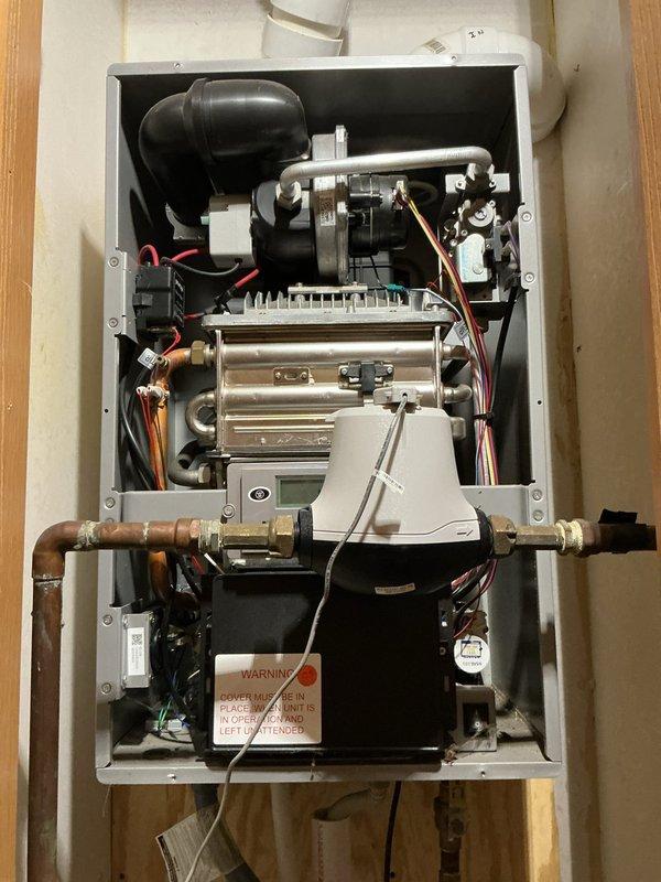 Diagnosed non-operational Westinghouse electric tankless water heater. Inspected internal components including heat exchanger, wiring connections, and control systems. Due to irreparable condition, completed documentation for replacement unit through emergency service request.