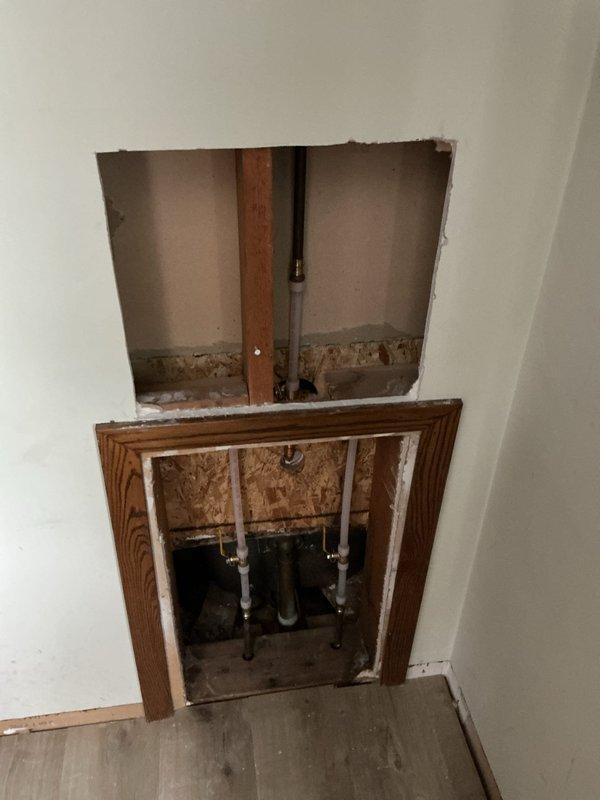 Investigated recurring shower valve leak that returned after previous service visit. Accessed plumbing through wall openings to diagnose the issue. Confirmed shower valve was still leaking during shower operation despite earlier repairs. Recommended replacement of the shower valve to permanently resolve the problem.