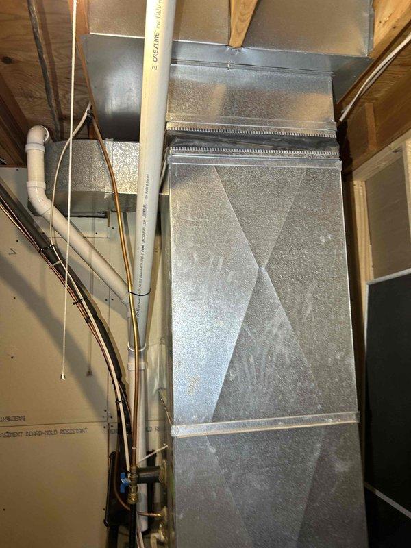 Performed comprehensive furnace tuneup on 2-year-old LP unit. Cleared condensation drain line and trap of accumulated spiderwebbing and debris. Verified proper operation of inducer motor, pressure switch, control board connections, and thermostat. Combustion analysis showed CO at 13 ppm, within acceptable range. System operating normally with no immediate concerns. Filter in moderate condition.