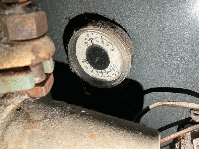 Responded to service call for non-functioning boiler system exhibiting loud squealing noise. Diagnostic inspection revealed failed inducer motor and severely plugged heat exchanger. Visual inspection confirmed extensive frost accumulation on components and significant corrosion on pressure gauge assembly. Performed complete replacement of inducer motor and boiler unit to restore proper heating function.