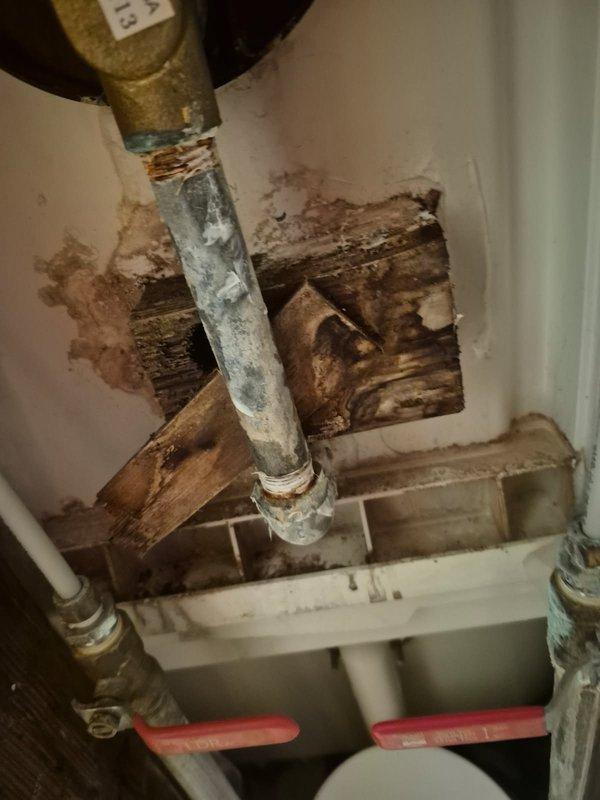 Diagnosed and repaired a leak in upstairs shower by replacing the damaged shower valve. Visual inspection revealed significant corrosion and mineral buildup on the existing valve assembly with evident water damage to surrounding wall structure. Installation of new shower valve successfully resolved the leak issue.