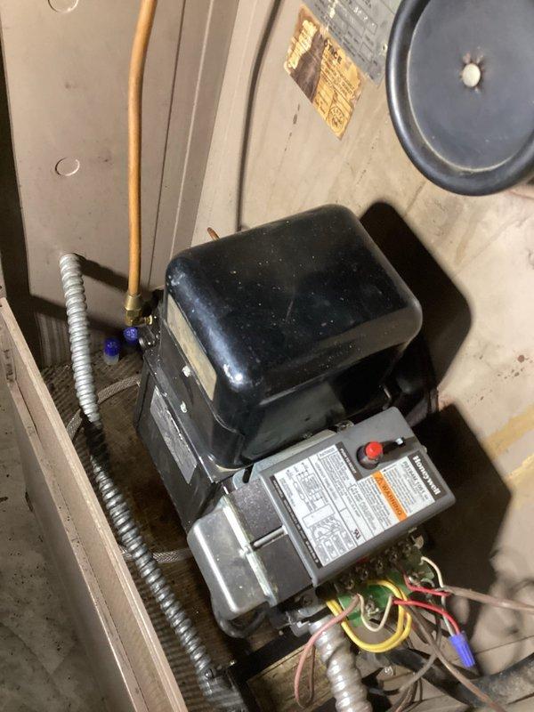 Responded to a first call service request to address ignition issues on an oil furnace. Diagnosed faulty ignition transformer, sourced replacement from shop, and installed new component. Properly reconnected all wiring and verified system operation through multiple test cycles. Equipment now functioning normally with proper flame ignition.