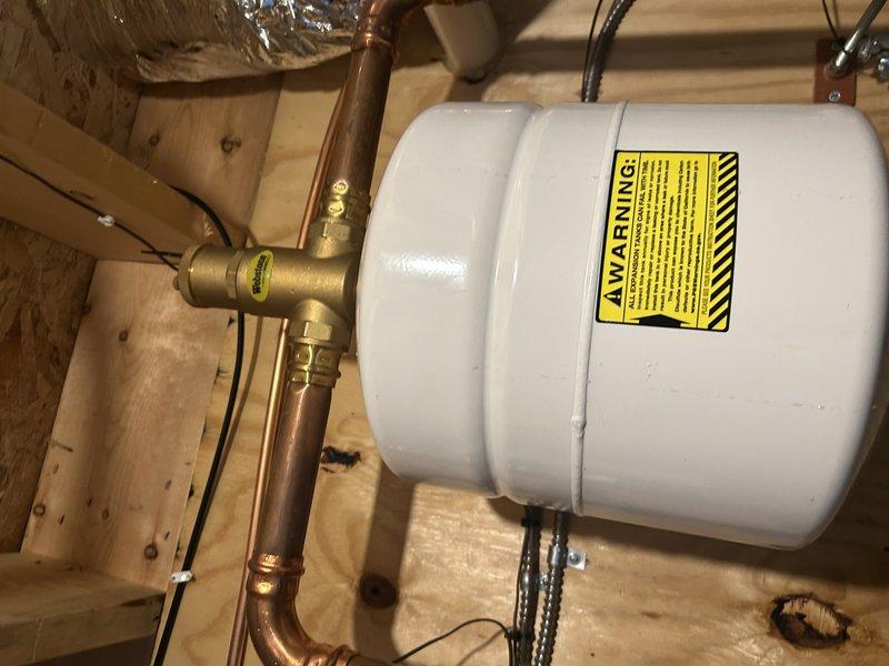 Performed annual boiler tune-up for new Family Reward member. Tested boiler operation at full temperature, verified proper system pressure, and cleaned the igniter. Discovered and partially removed a dead bird from the condensate trap, restoring normal operation. Inspected expansion tank and system for leaks; all components functioning properly.