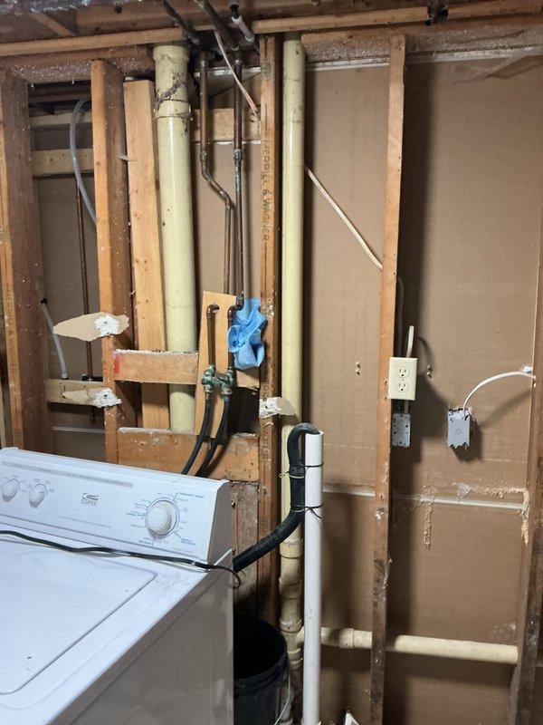 Located and repaired a water leak caused by a nail puncture in the copper supply line. Replaced the damaged section of piping in the utility area behind the washing machine where exposed framing and piping were accessible. Tested the repaired section to ensure proper water flow with no leaks.