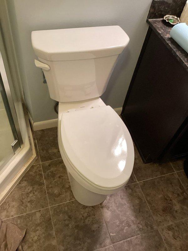 Successfully completed installation of new ADA-compliant Gerber Viper comfort height toilet as scheduled. The upgraded toilet features an elongated bowl for enhanced comfort and includes a sanitary bar to prevent liquids from accumulating under the tank. Properly secured with new wax ring and bolts, then caulked and tested to ensure proper operation.