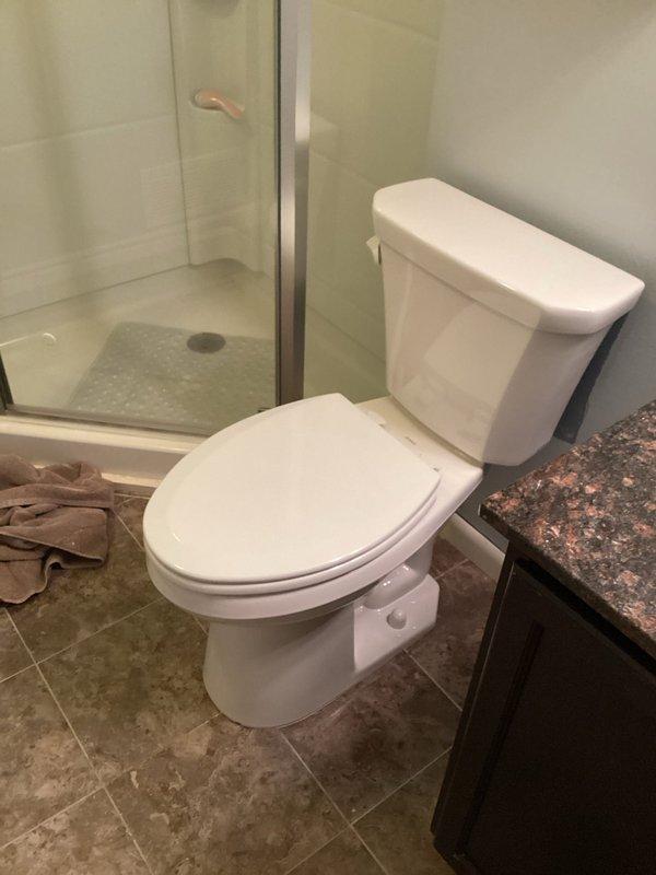 Successfully completed installation of new ADA-compliant Gerber Viper comfort height toilet as scheduled. The upgraded toilet features an elongated bowl for enhanced comfort and includes a sanitary bar to prevent liquids from accumulating under the tank. Properly secured with new wax ring and bolts, then caulked and tested to ensure proper operation.