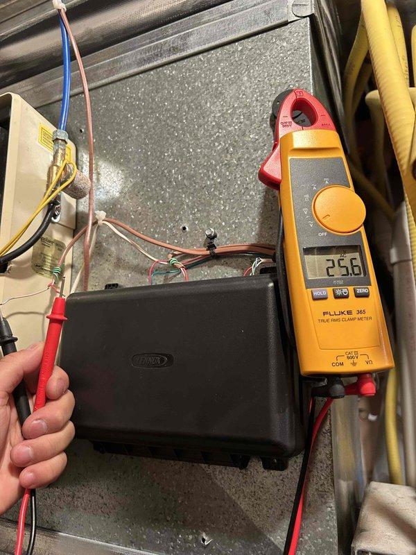 Diagnosed non-operational humidifier on previously installed HVAC system. Verified 24V power supply to solenoid using Fluke 365 True RMS Clamp Meter and confirmed solenoid resistance at 35.5 ohms. Observed intermittent clicking of faulty solenoid that remained in closed position despite proper voltage. Replaced defective solenoid to restore proper humidifier function.