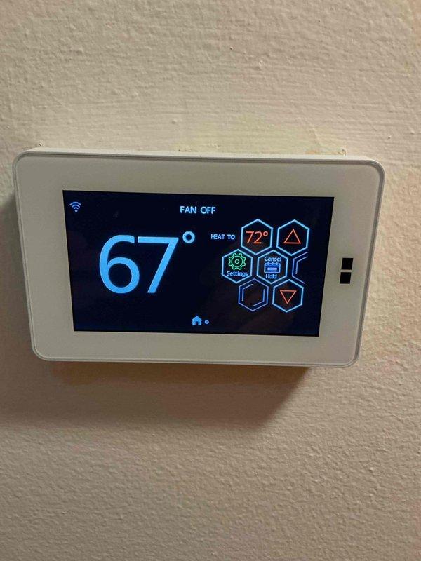 Responded to customer concern about heat pump operation during subfreezing temperatures. Performed diagnostic inspection of system and thermostat wiring. Verified heat pump was functioning according to proper specifications. Confirmed outdoor temperature sensor readings and thermostat programming settings were correct. No system deficiencies found.